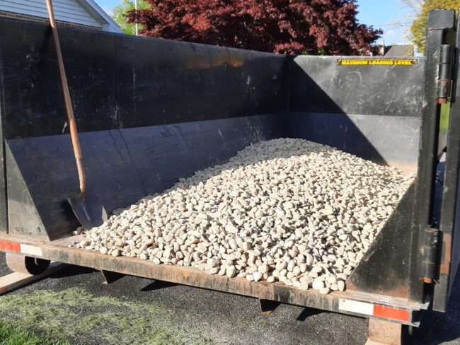 Stone in a box cover image 15 yard dumpster rental for landscape material delivery 1