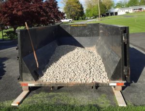 Stone in a box cover image 15 yard dumpster rental for landscape material delivery 2