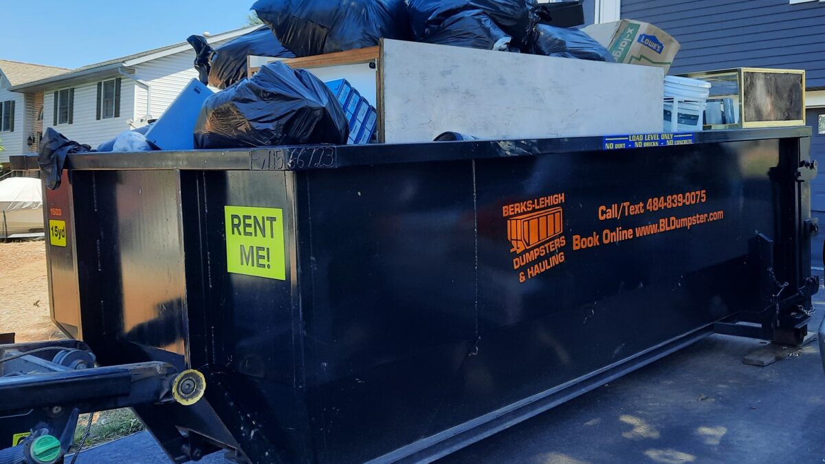 Over full dumpster rental