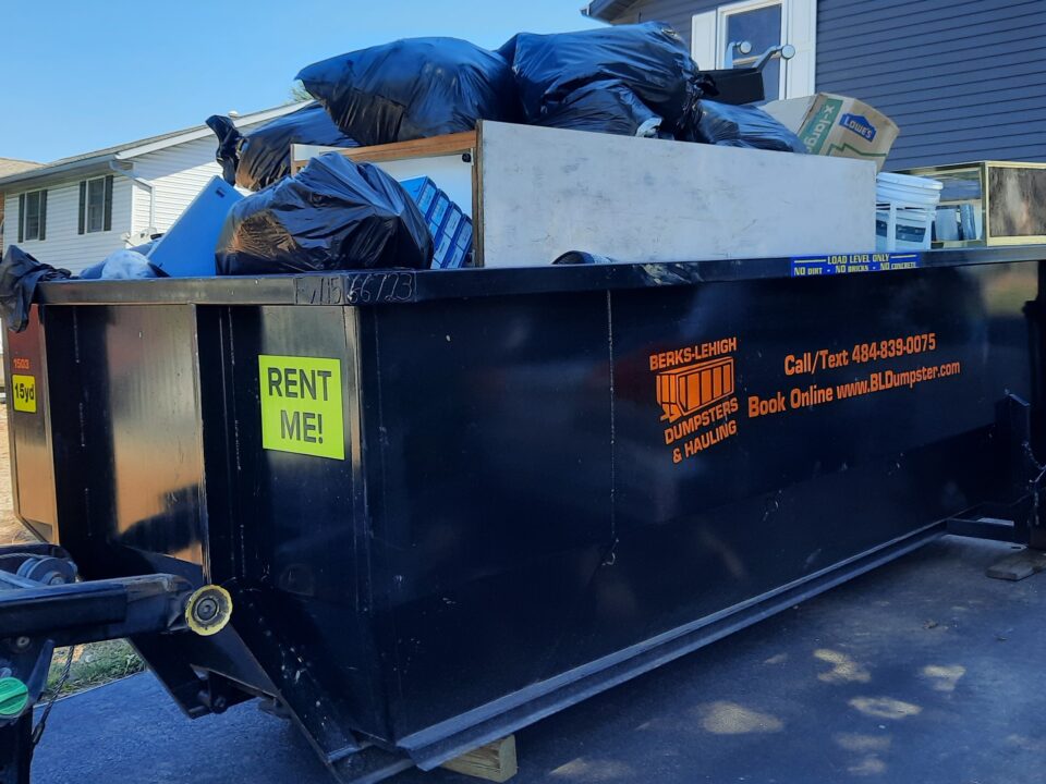 Over full dumpster rental